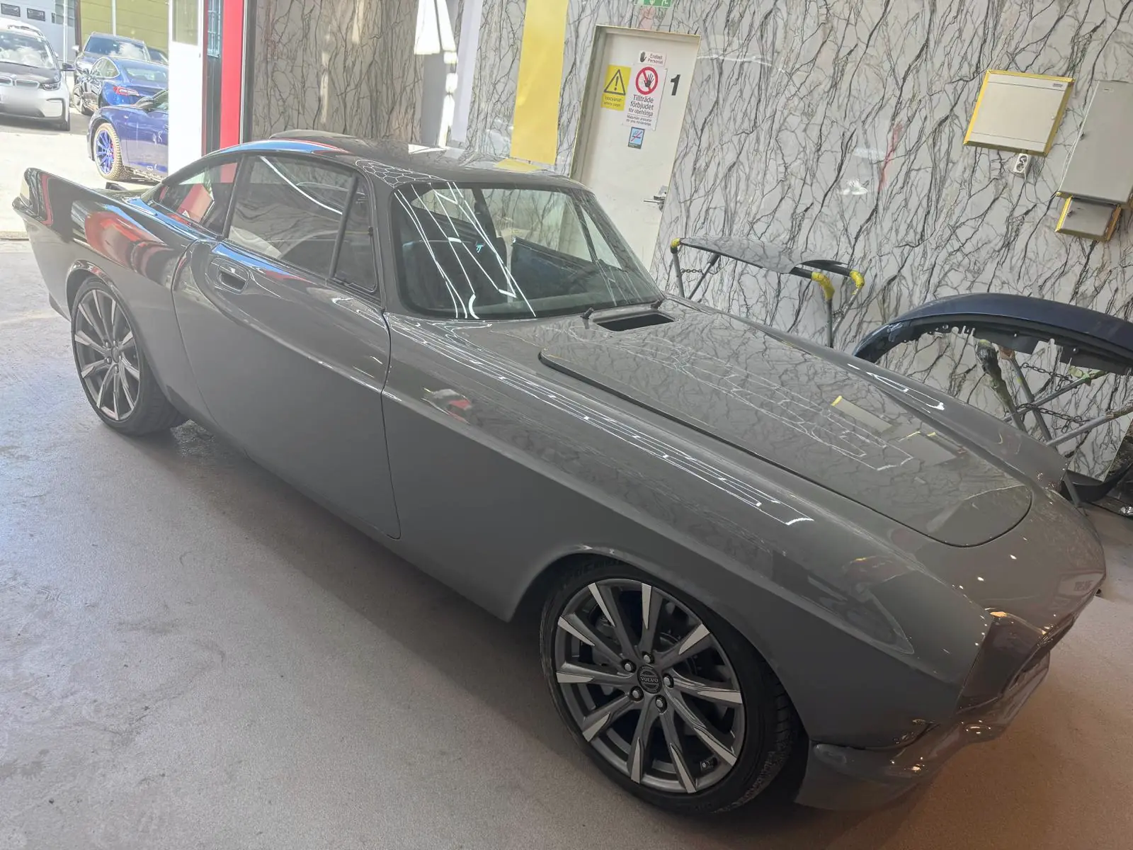 Grey classic car in the workshop